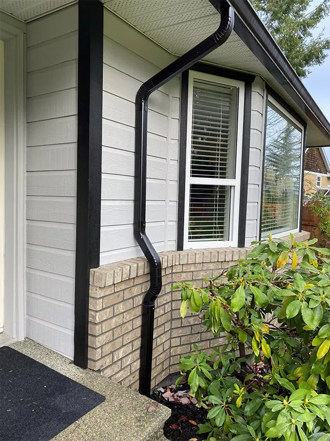 New black downspout installation — Gutter King, Vancouver Island