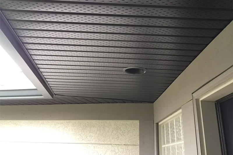 Black aluminum soffit with pot light installed by Gutter King